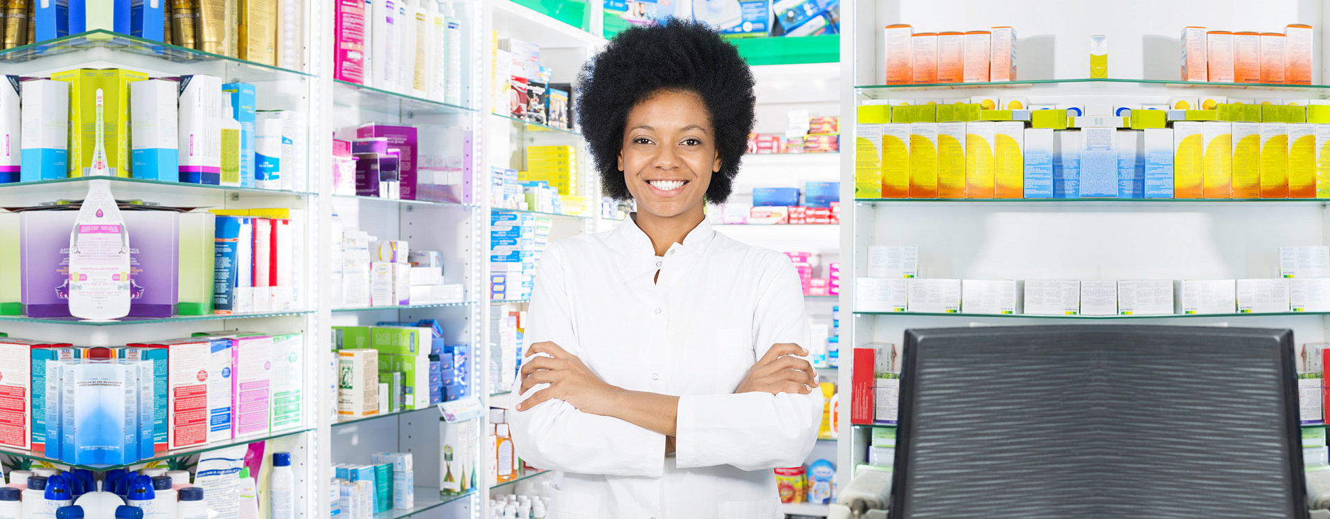 pharmacist crossing her arms with a big smile