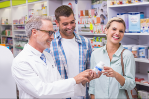 pharmacist assisting young couple